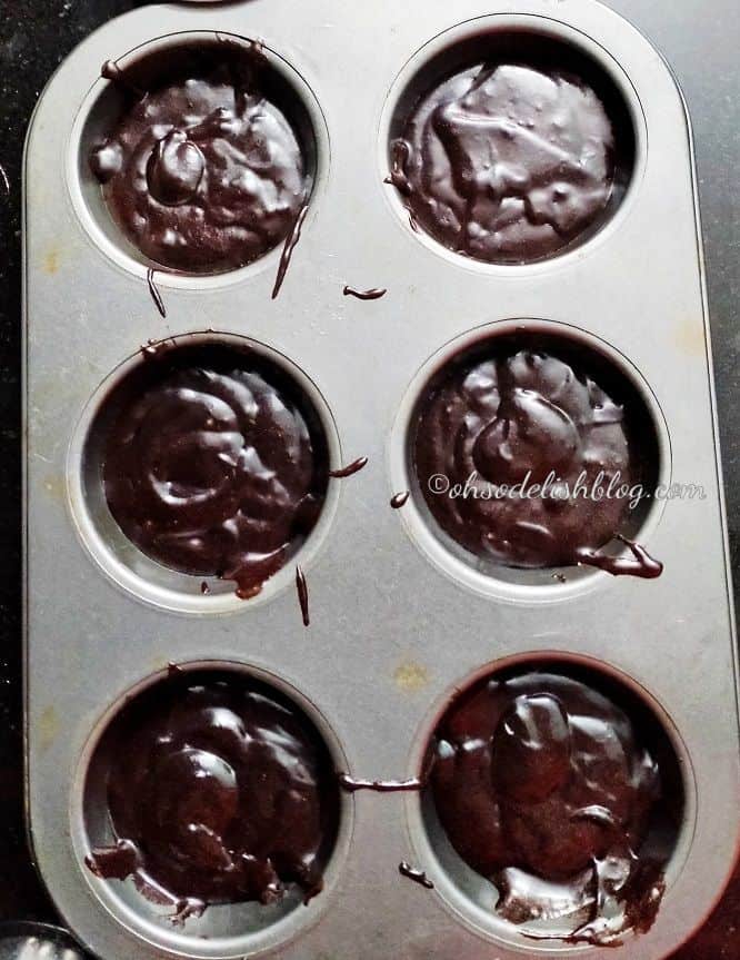 brownie batter poured into the muffin tray