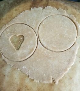 circle and heart shape cut outs on dough