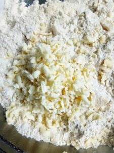 grated butter on white flour